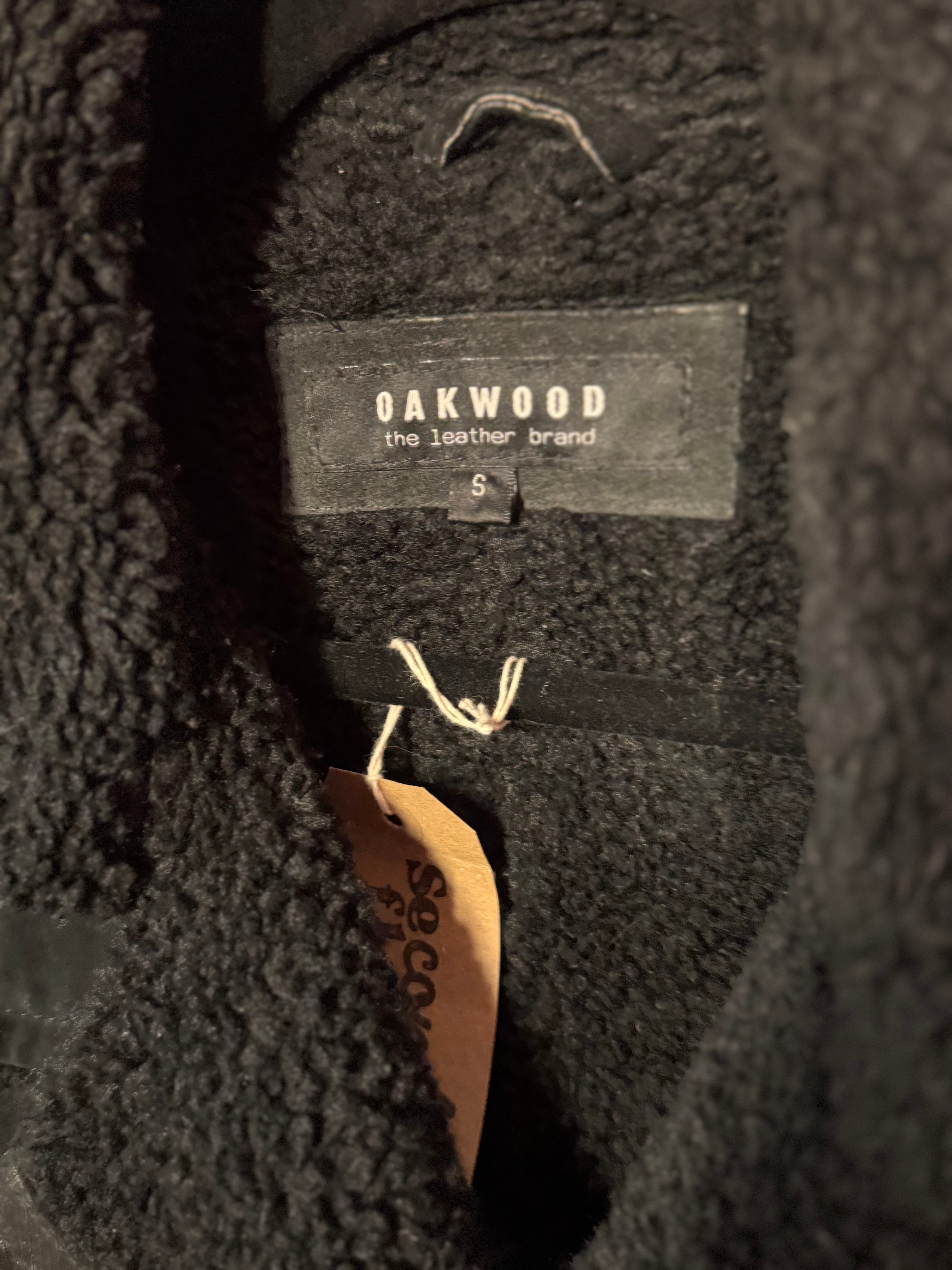 Manteau en daim fausse fourrure noire