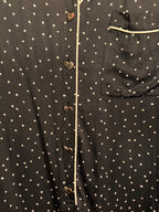Combinaison noire à pois en forme de cœur